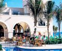 Pool with palms and tables